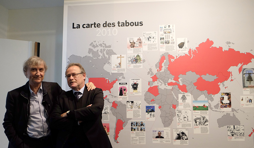 Plantu and Jacques Terrière in front of the Map of taboos 2010