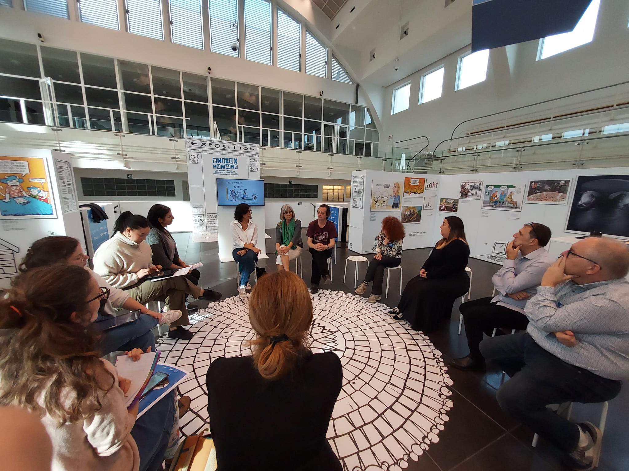 Willis from Tunis (Tunisia), Cecile Bertrand (Belgium) and Cost. (Belgium) in a workshop with students